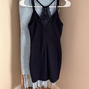 Navy form fitting knee length dress with small slit!